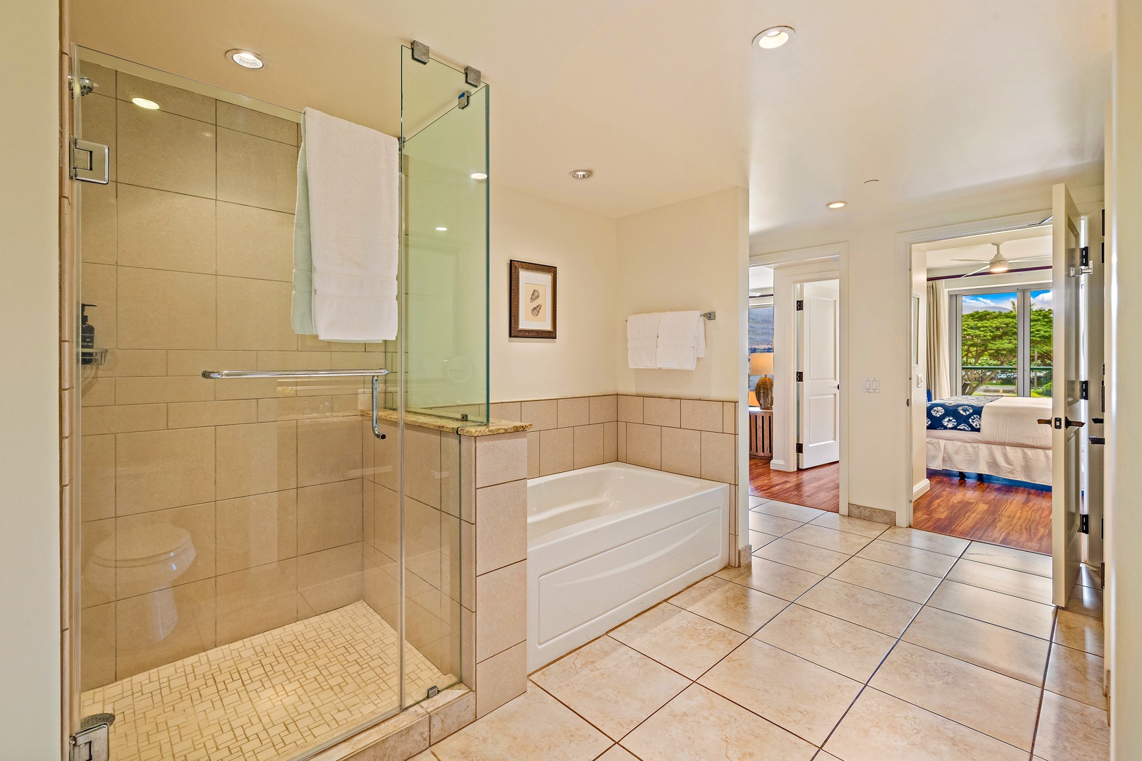 Lahaina Vacation Rentals, Honua Kai Konea 206 - This spacious bathroom offers both a glass-enclosed walk-in shower and a large soaking tub, providing options for relaxation and refreshment.