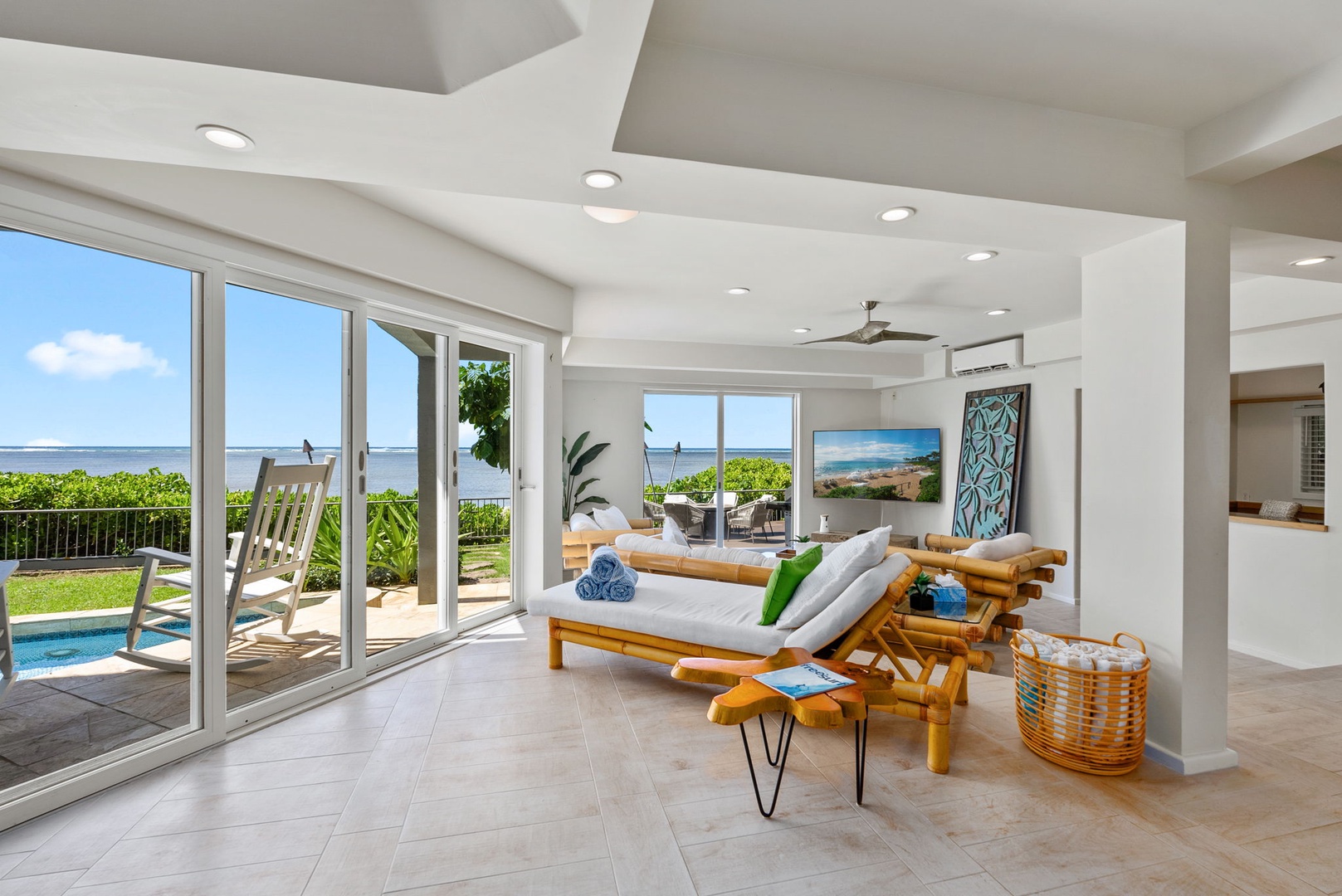 Honolulu Vacation Rentals, Wailupe Beachfront Getaway - Indoor chaise loungers are also in the living area with ocean views.