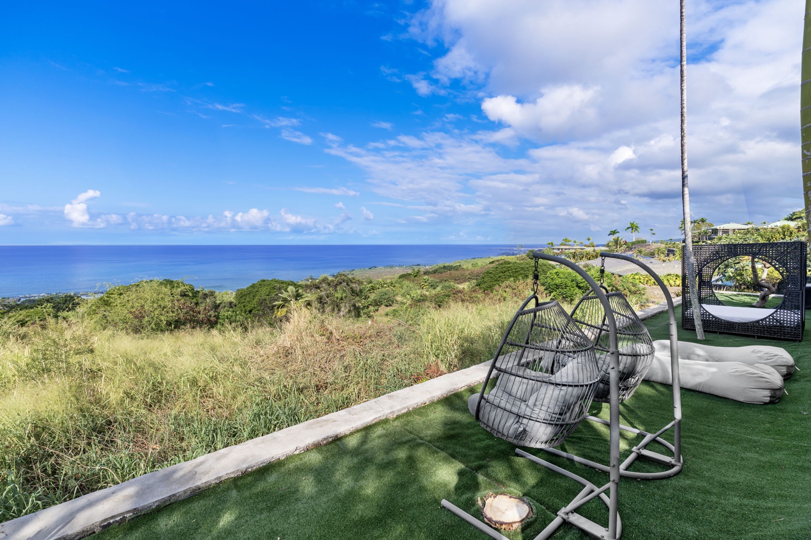 Kailua Kona Vacation Rentals, Hale Nai'a - Swing gently in your private hanging chair while soaking up breathtaking ocean views and tropical breezes from your terrace.