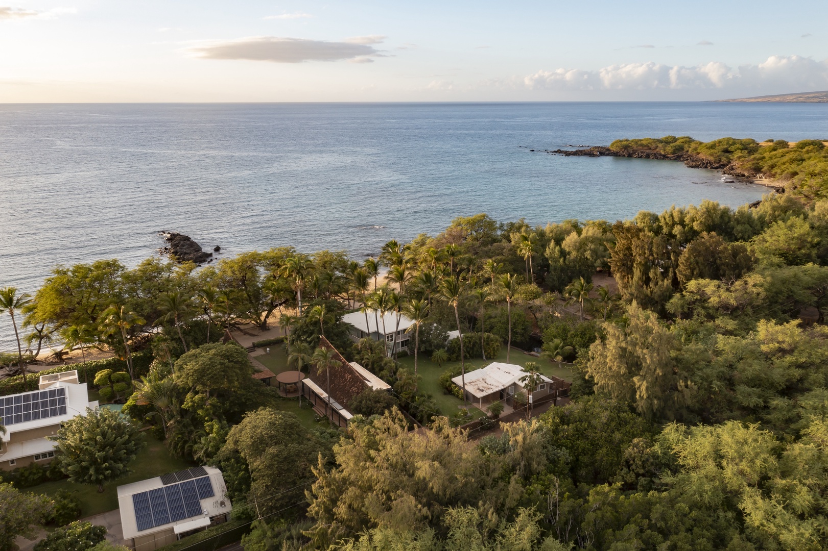 Kamuela Vacation Rentals, Hui Pu - Aerial view of the property nestled along the coastline, showcasing breathtaking ocean views.