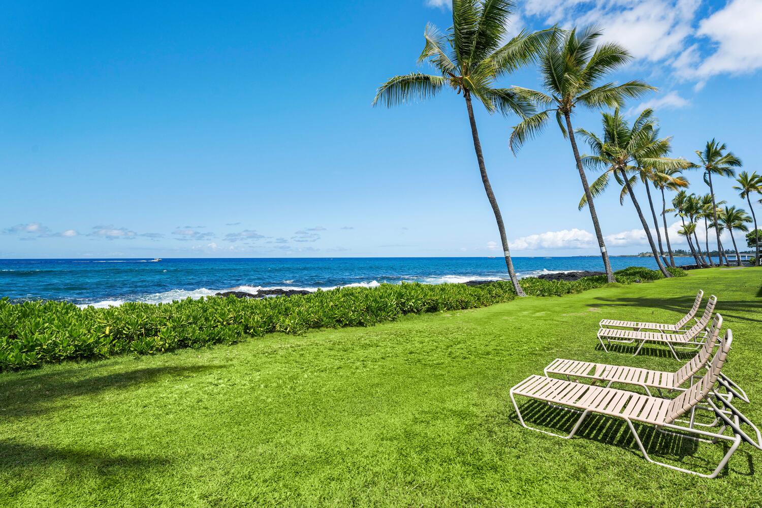 Kailua-Kona Vacation Rentals, Kona Reef B32 - Relax on the outdoor chaise loungers by the beach.