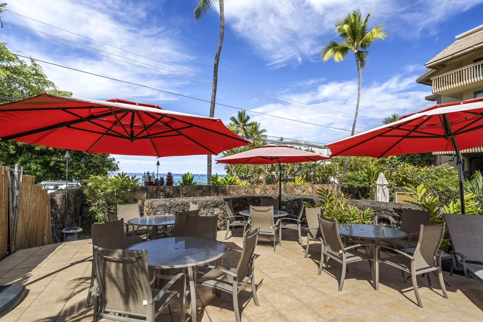 Kailua Kona Vacation Rentals, Royal Kahili 401A - Rocky beachfront with a kayak ready for exploration and stunning coastal views.