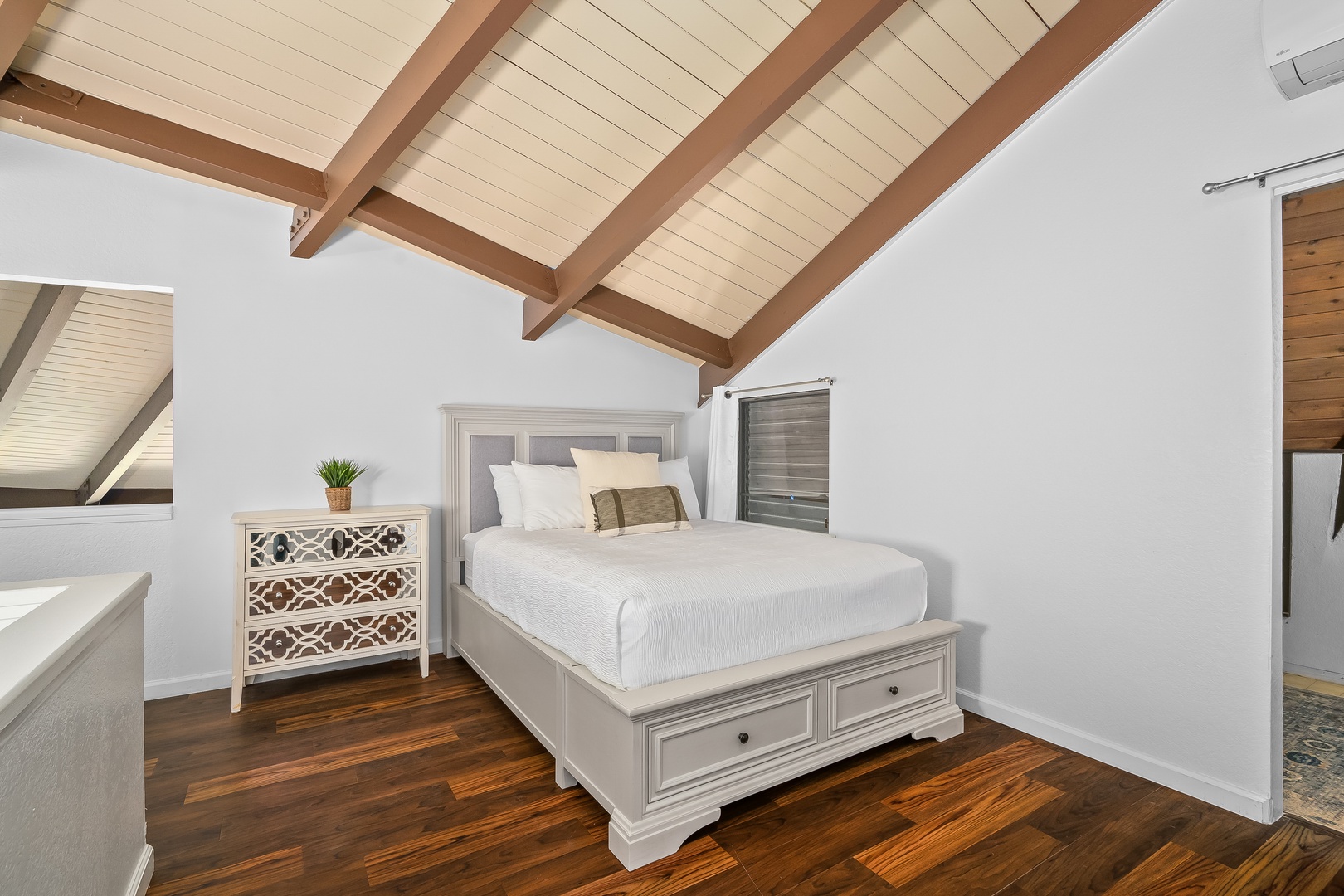 Princeville Vacation Rentals, Mauna Kai 7B - The lofted sleeping space keeps to itself, hardwood floors and all.