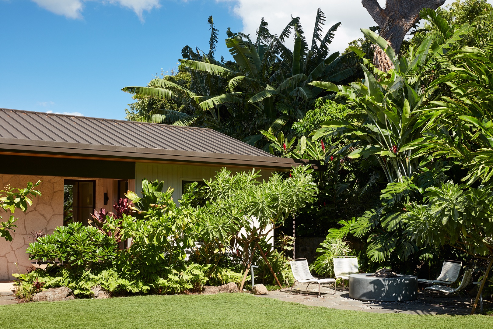 Honolulu Vacation Rentals, Diamond Head Hillside Estate** - Surrounded by vibrant greenery, the property's beautifully landscaped grounds offer space to relax, explore, and enjoy the outdoors.