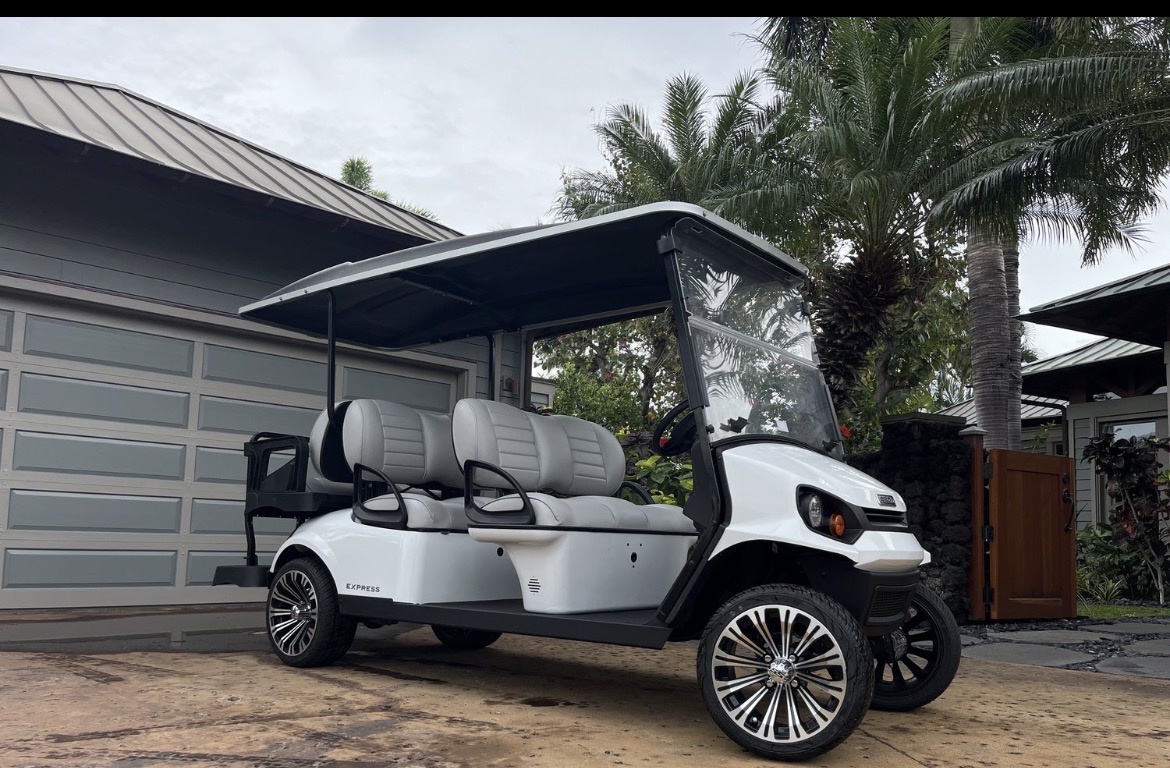 Kamuela Vacation Rentals, 3BD Na Hale 3 at Pauoa Beach Club at Mauna Lani Resort - Modern golf cart parked outside the property, offering convenient on-site transportation for exploring the resort grounds and nearby areas.