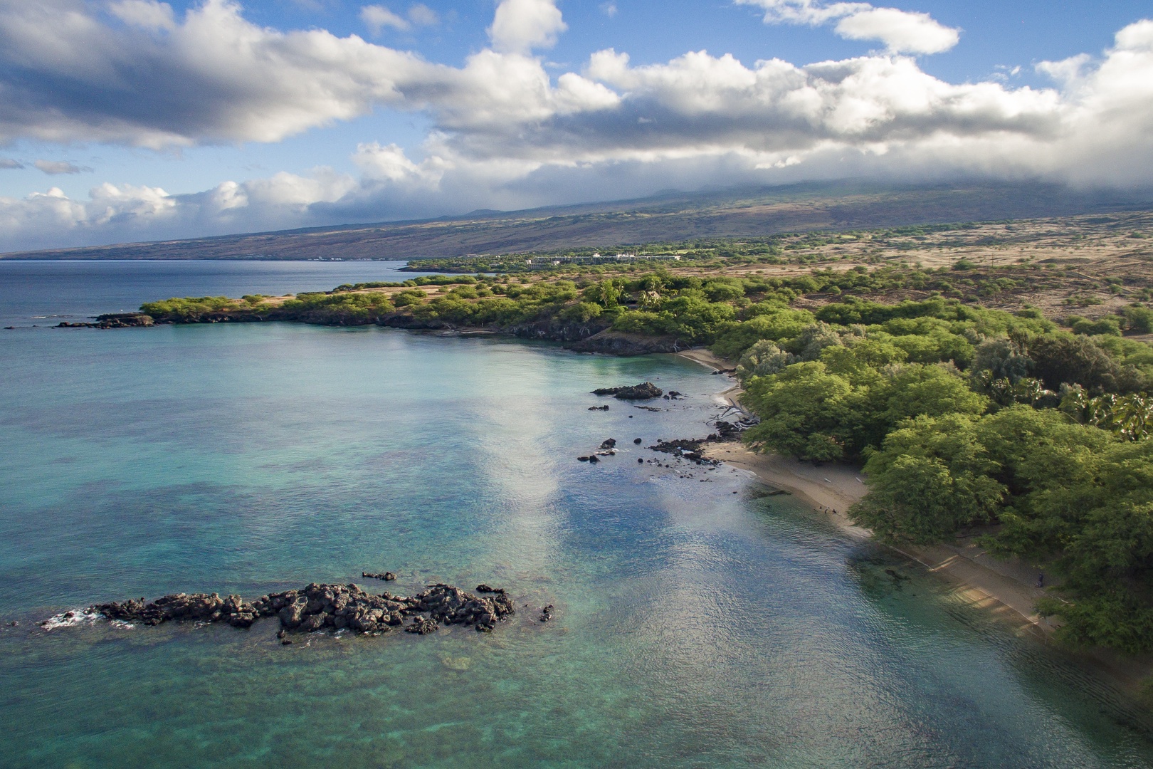 Kamuela Vacation Rentals, Hui Pu - Scenic coastline with calm, clear waters and lush greenery—an ideal spot for peaceful nature walks and ocean views.