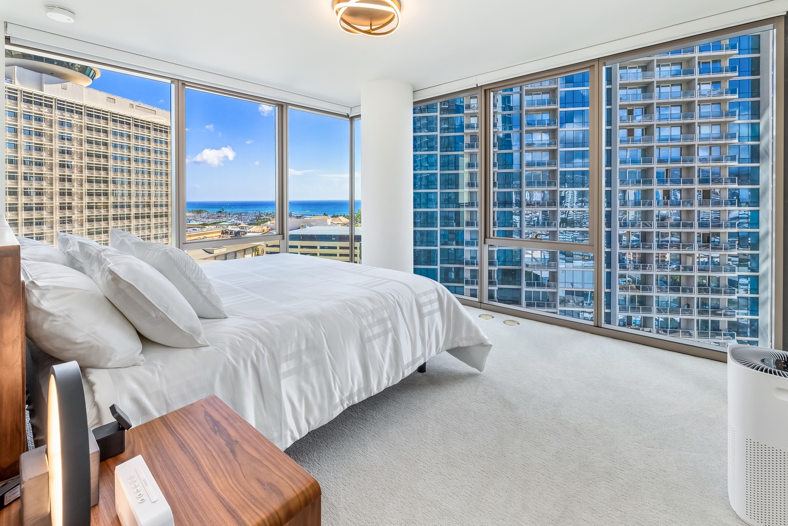 Honolulu Vacation Rentals, Sky Ala Moana #1701 - The primary suite has floor to ceiling glass walls, king-sized bed and split AC.