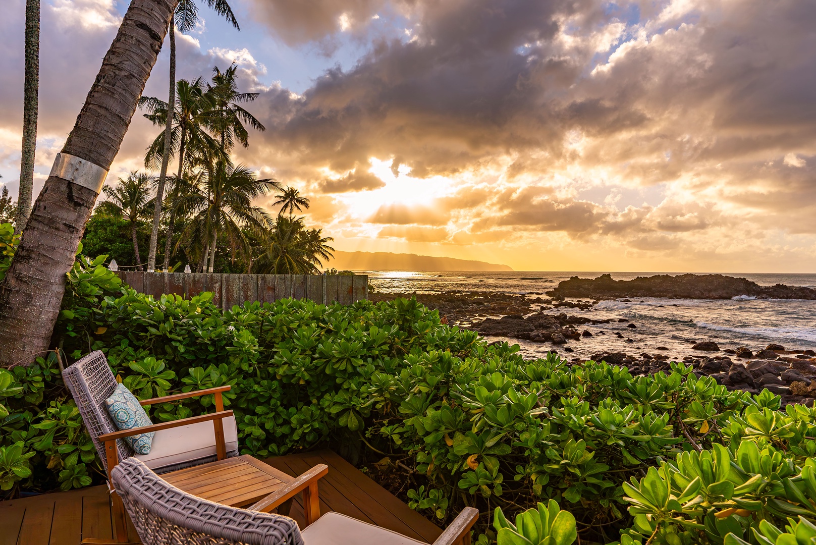 Haleiwa Vacation Rentals, Samurai House - Golden hour magic on a private deck with sweeping oceanfront scenery.