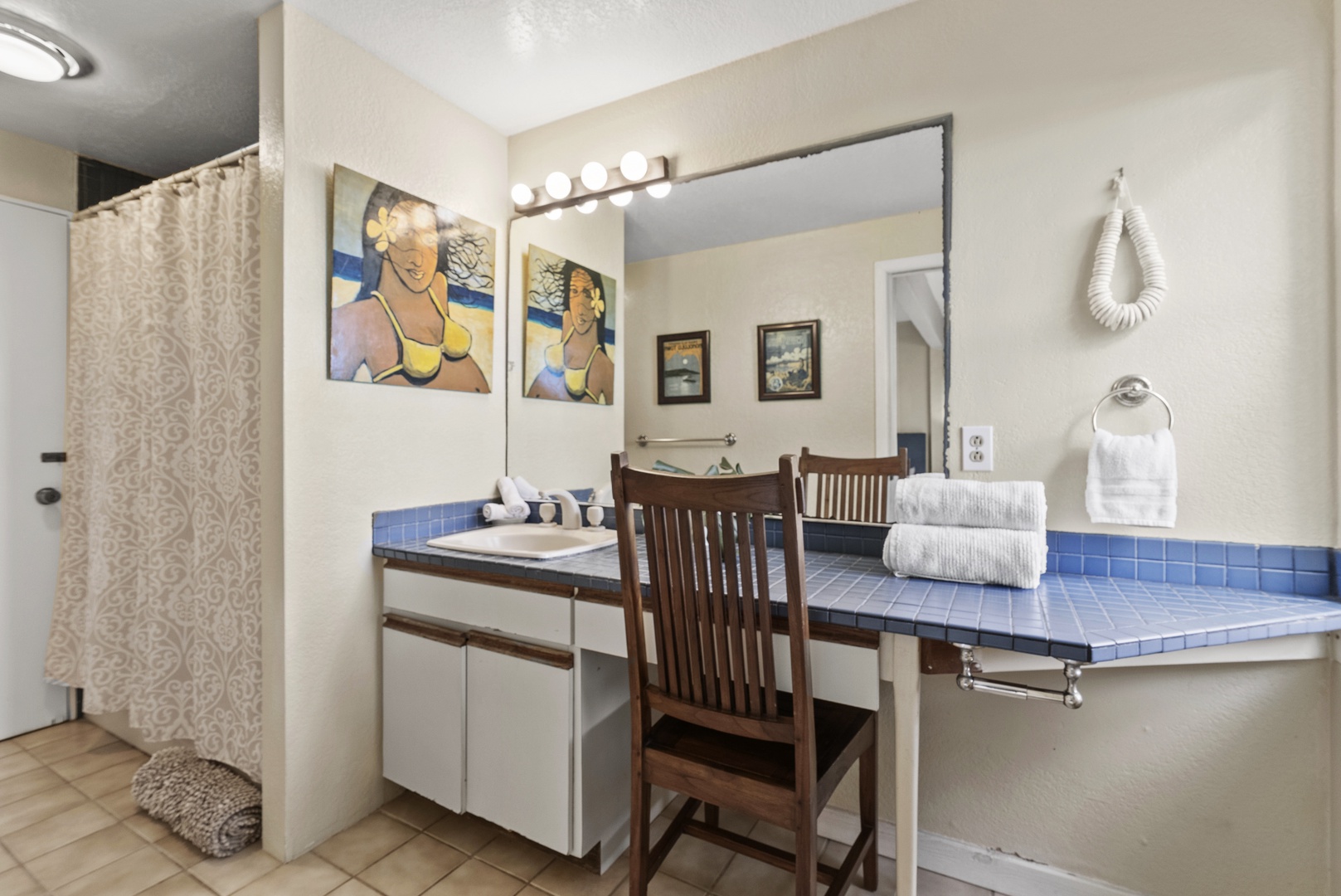 Haleiwa Vacation Rentals, North Shore Beachfront Retreat - Guest bathroom ensuite with a vanity area and a walk-in shower.