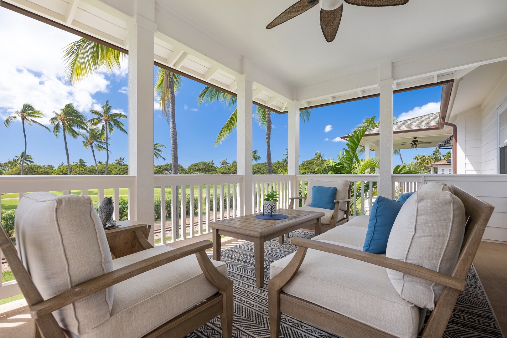 Relax in your private covered lanai with plush seating while tropical palms sway beyond the windows.