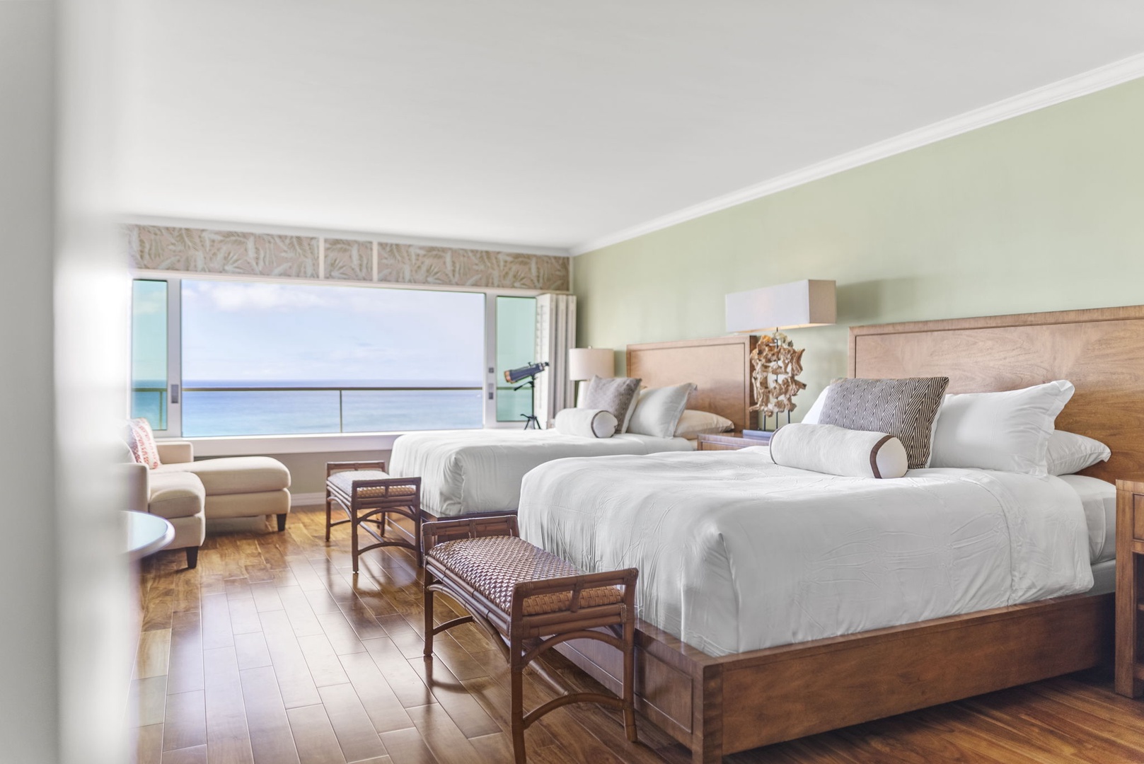 Honolulu Vacation Rentals, Kaimana Breeze - Two comfortable beds with ocean views, hardwood floors, and tasteful decor create a warm and welcoming retreat.