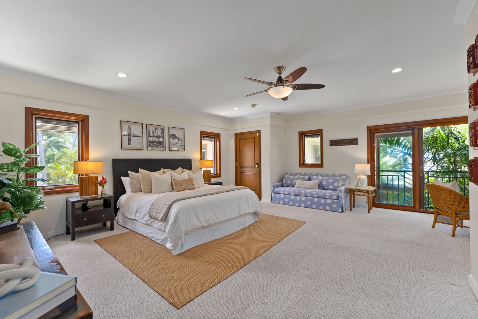 Honolulu Vacation Rentals, Maunalua Estate - French doors and tropical greenery bring a relaxed island feel to this spacious bedroom sanctuary.