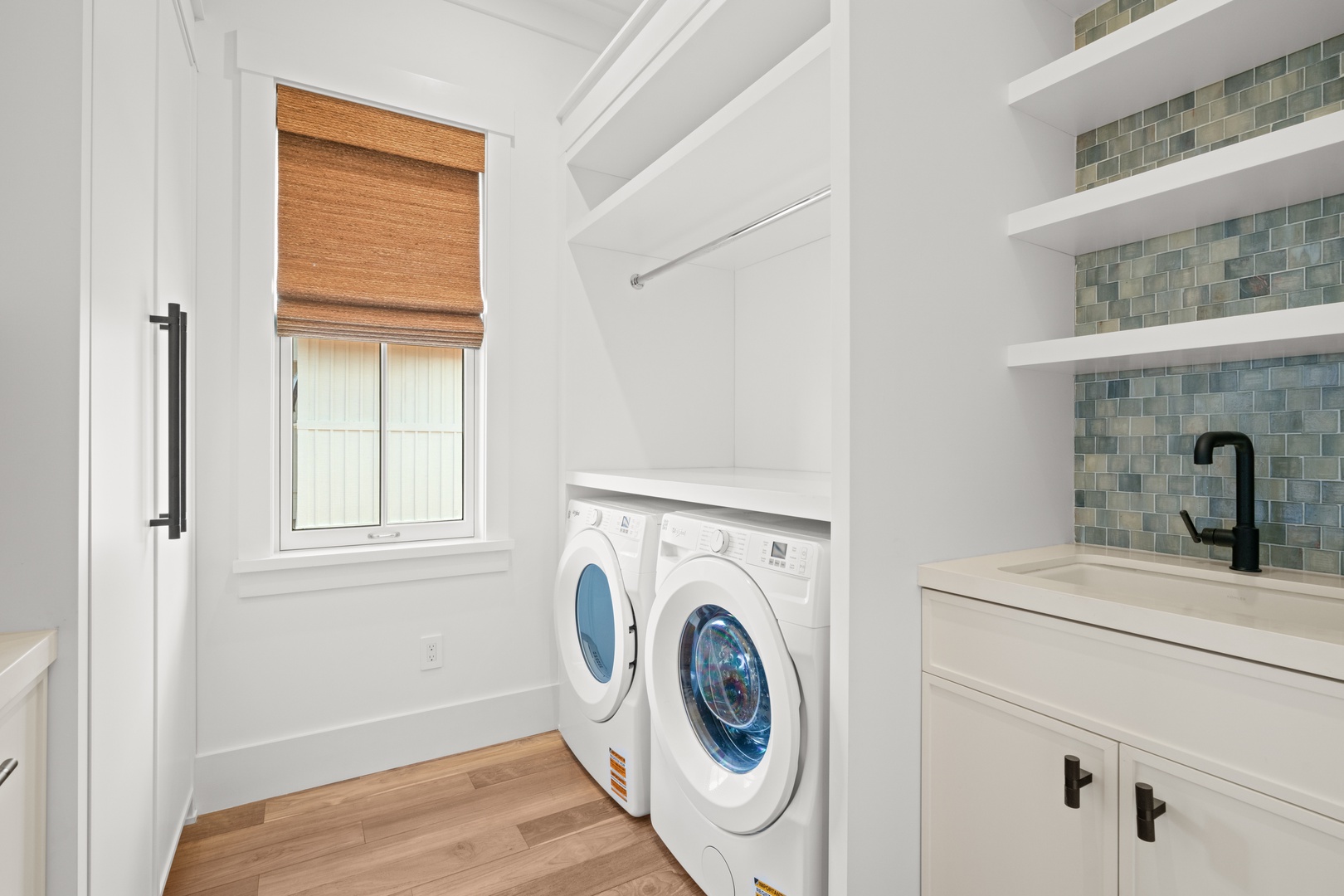 Koloa Vacation Rentals, Makani Kai - A spacious laundry room with side-by-side machines, perfect for longer stays.