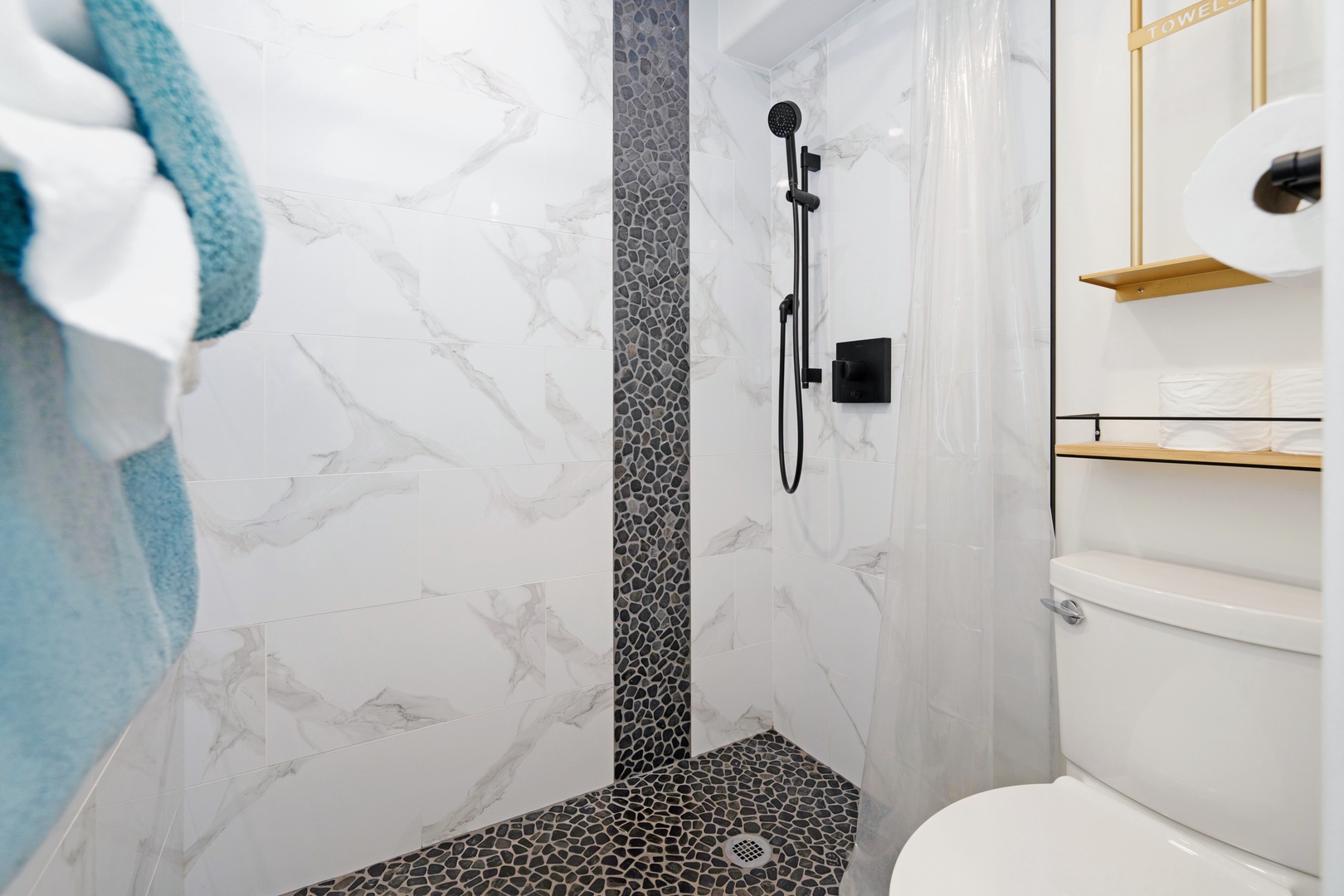 Kihei Vacation Rentals, Punahoa Beach 205 - A rainfall shower head and fresh towels make rinsing off sand feel like a small luxury.