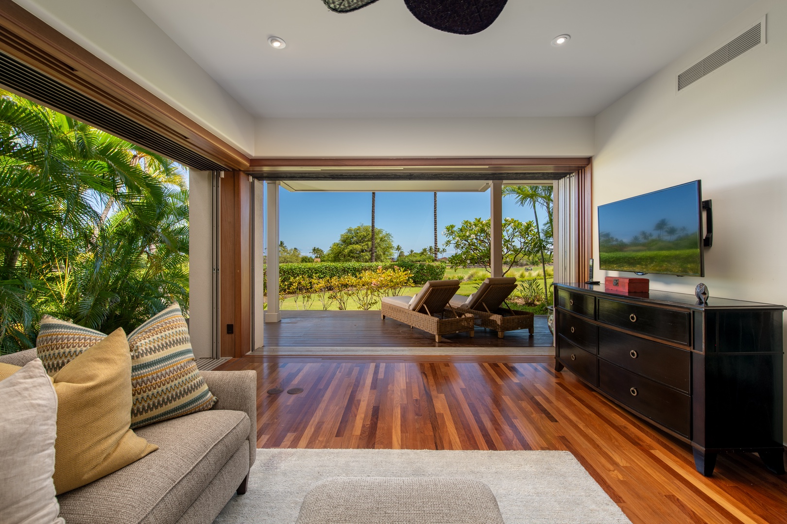 Kailua Kona Vacation Rentals, 3BD Ka'Ulu Villa (109A) at Four Seasons Resort at Hualalai - Looking at the lanai with dual chaise loungers.