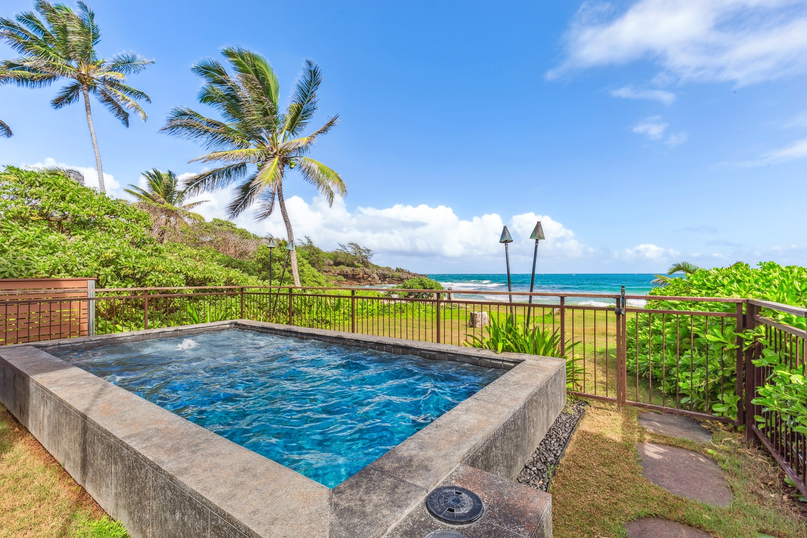 Laie Vacation Rentals, Majestic Mahakea Oceanfront Oasis - Spacious lanai featuring lounging options and refreshing ocean breezes.