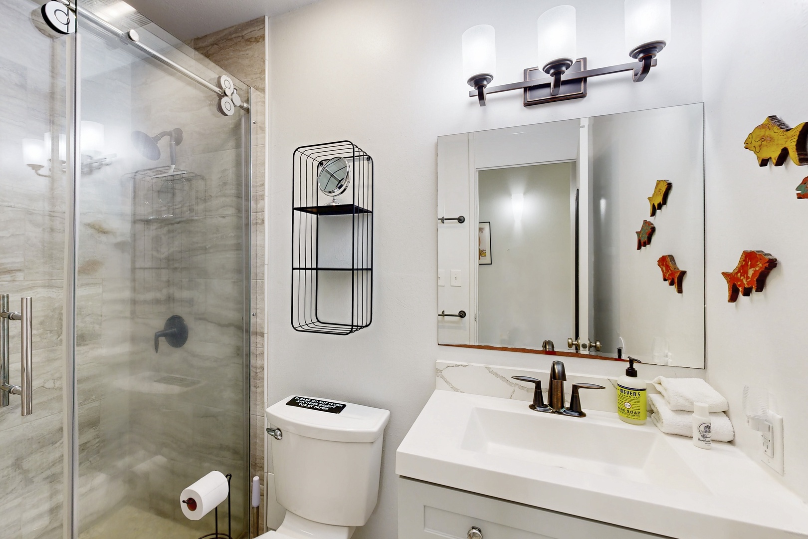 Kahuku Vacation Rentals, Kuilima Estates West #132 - Bathroom with walk-in shower and clean finishes.