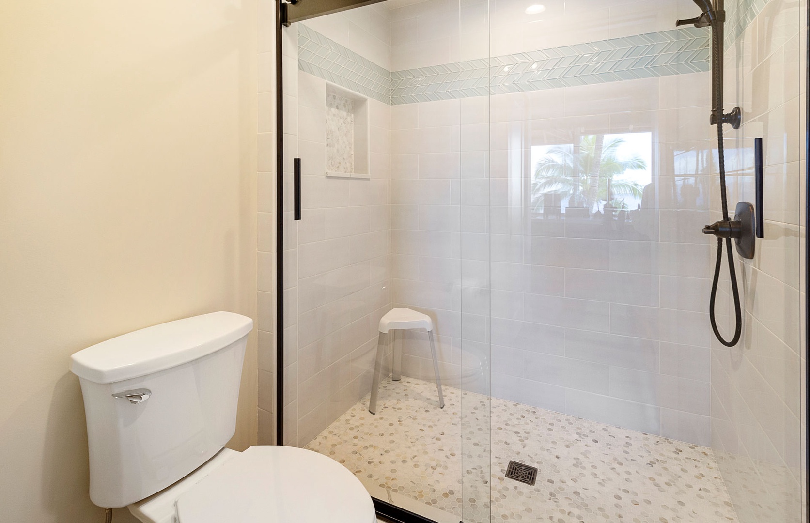 Lahaina Vacation Rentals, Puamana 240-3 - Refresh in a modern, spa-inspired primary bathroom with a sleek walk-in shower.