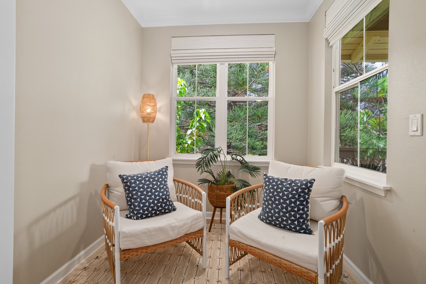 Princeville Vacation Rentals, Hale Kaua'i - Sip coffee and settle into quiet moments in this cozy seating nook surrounded by greenery.