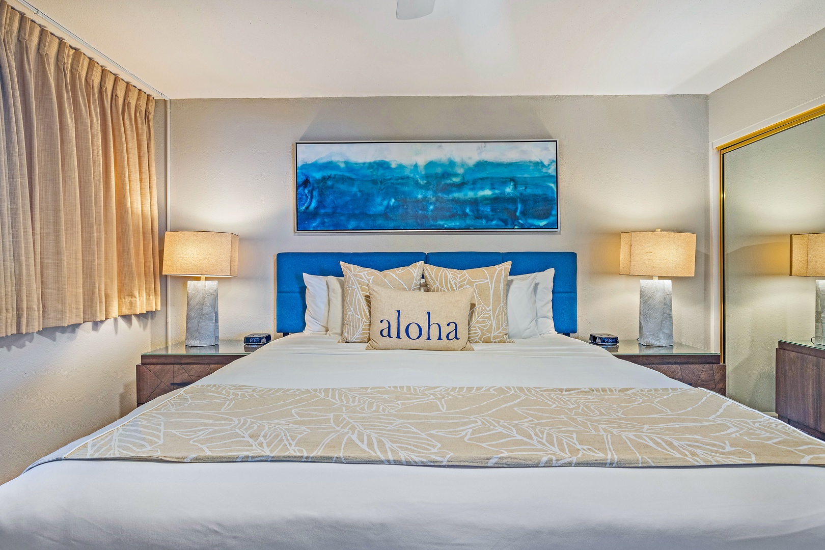 Lahaina Vacation Rentals, Royal Kahana 1010 - The king-sized bed, accented with tropical decor and soft lighting, creates a serene and welcoming atmosphere.