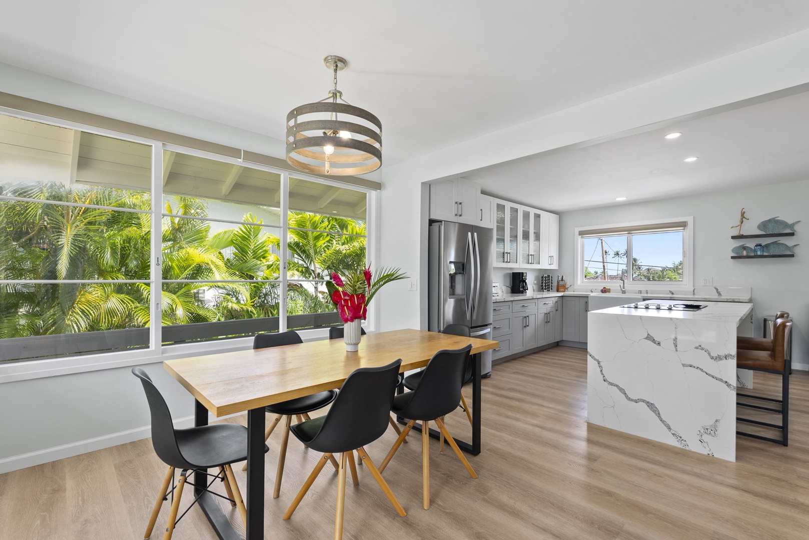 Kailua Vacation Rentals, Hale Alapi'i Lanikai Getaway - Enjoy meals and moments in this well-lit dining area that offers a view of lush greenery outside