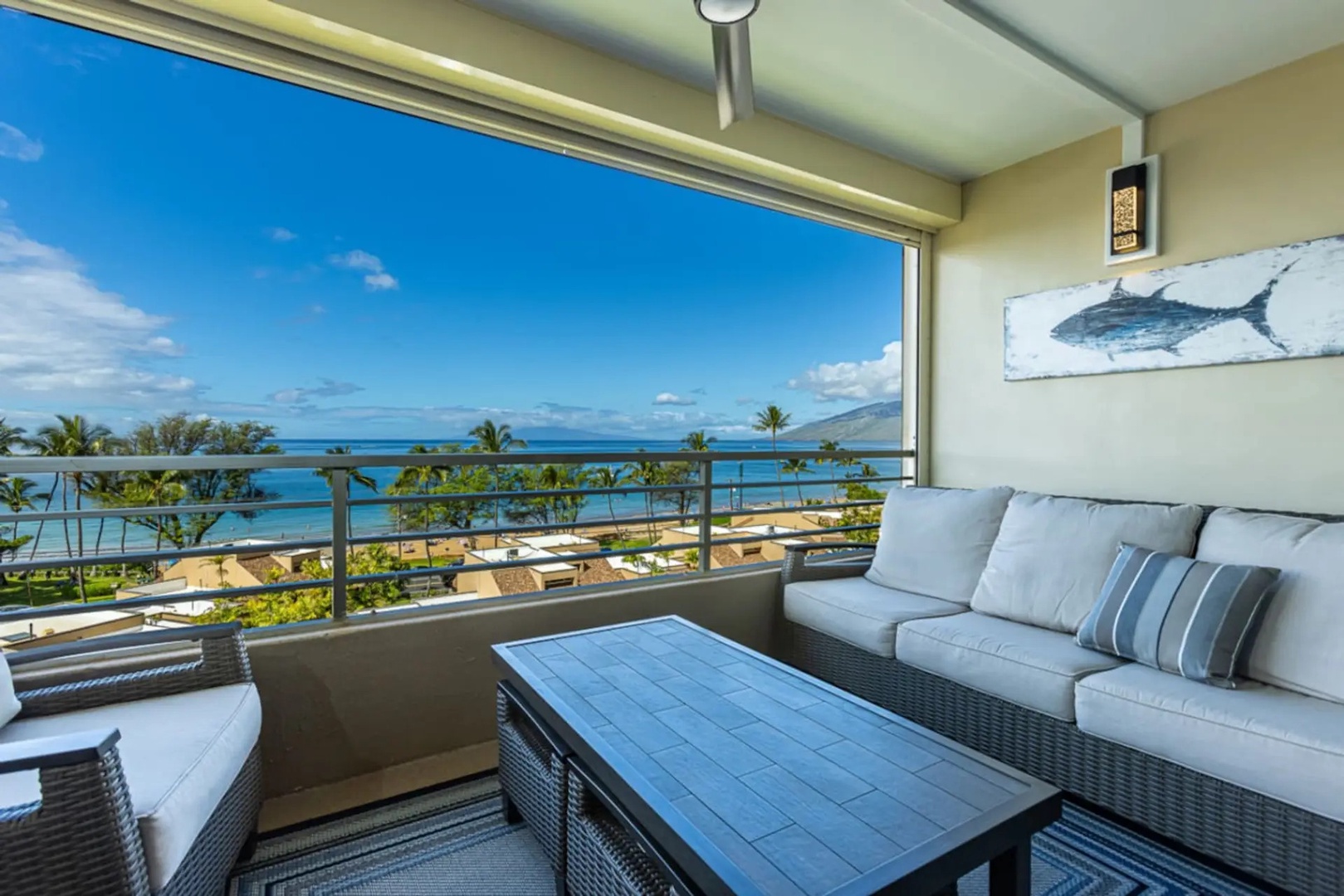 Kihei Vacation Rentals, Kamaole Beach Royal 610 - Settle into the lanai sofa and enjoy the ocean straight ahead.