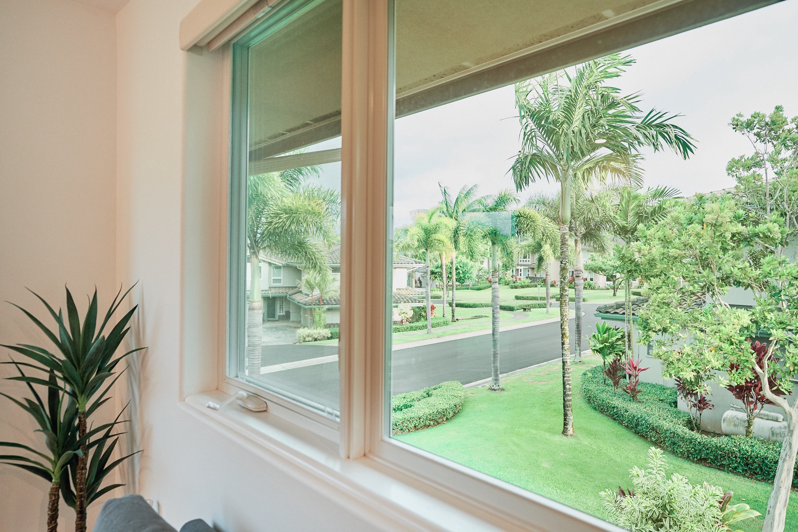 Princeville Vacation Rentals, Hale Kai - Wake up to tropical palm trees and manicured gardens outside your window, creating a peaceful paradise right at your doorstep.