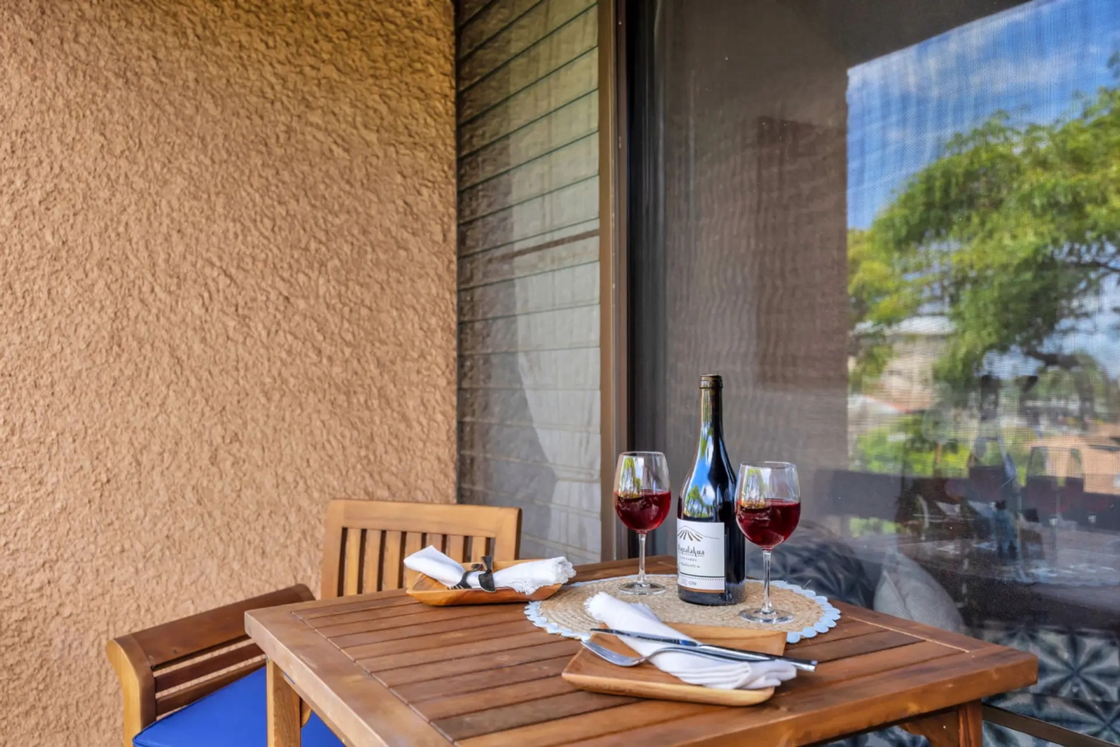 Kihei Vacation Rentals, Maui Vista 2420 - Two glasses and an open bottle on the balcony, the easy end to a Maui afternoon.