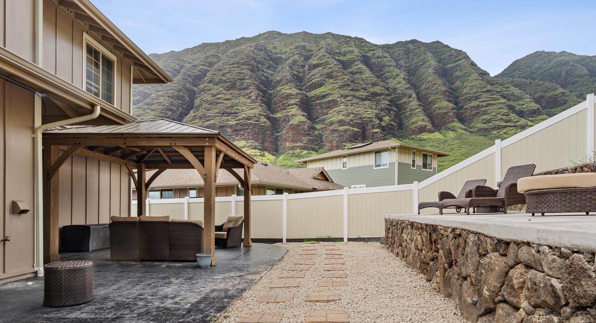 Makaha Valley Vacation Rentals, Makaha Valley Hale Kai** - Outdoor seating pavilion with mountain backdrop, made for shaded relaxation.