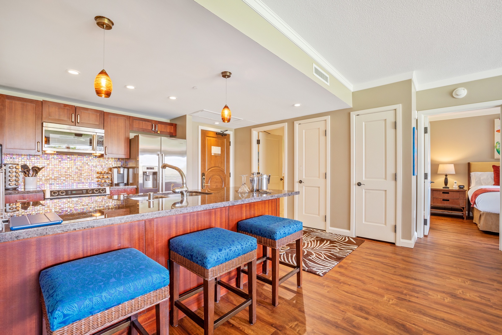 Lahaina Vacation Rentals, Honua Kai Konea 204 - The kitchen bar with seating for three, perfect for quick meals and entertainment.