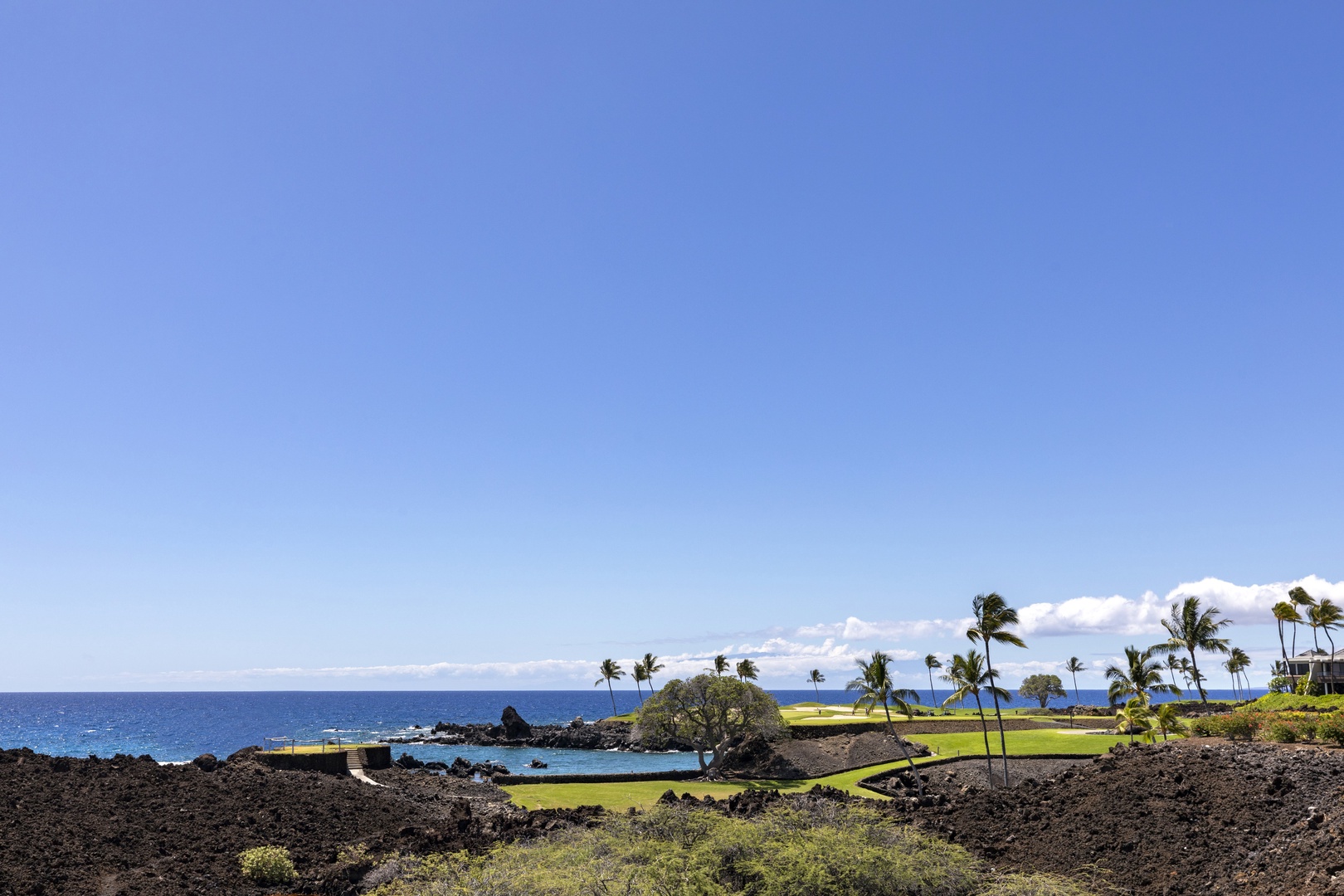 Kamuela Vacation Rentals, Mauna Lani Point E105 - Gaze out at the stunning South Course fairway and sparkling ocean horizon beyond.