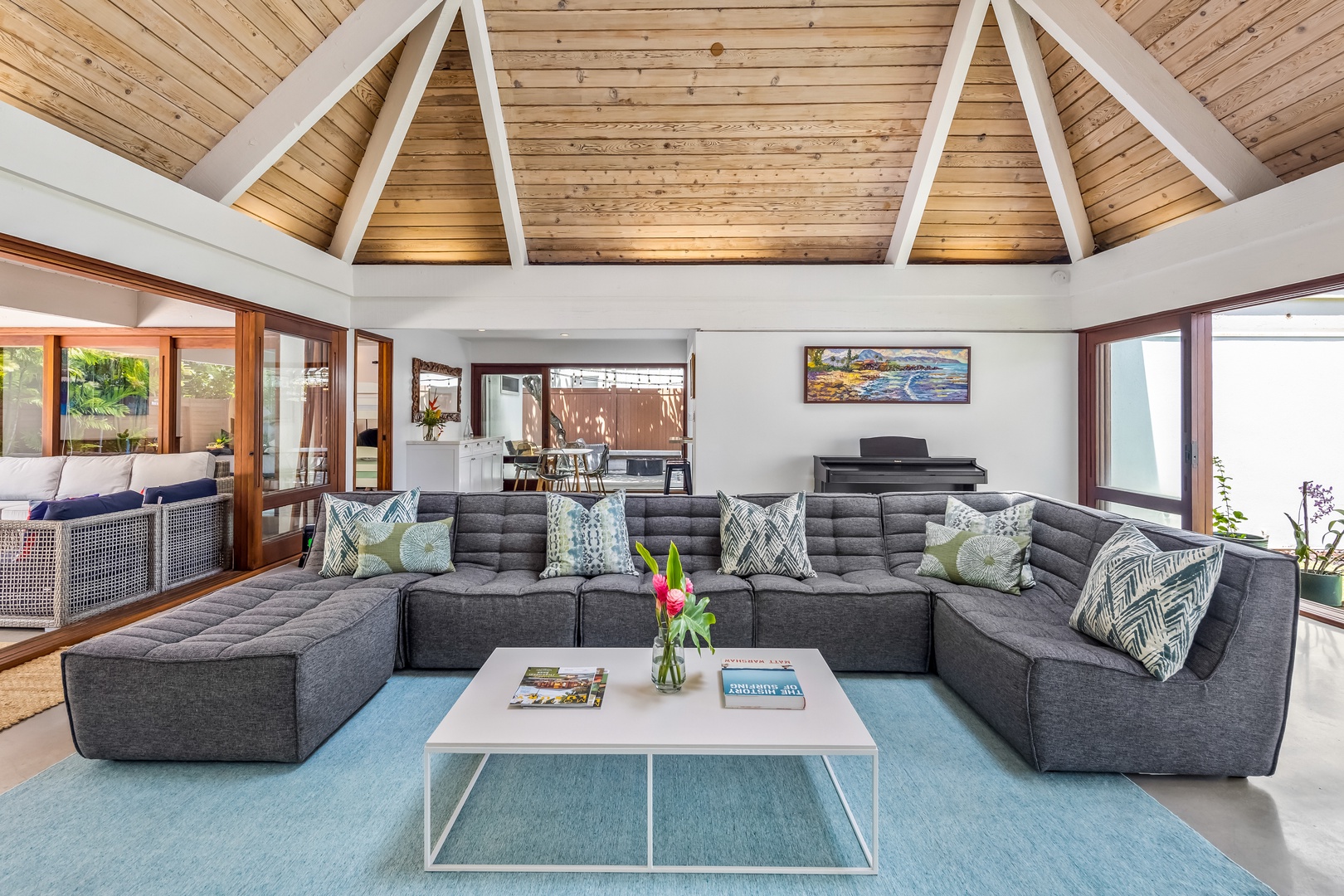 Kailua Vacation Rentals, Lokomaika'i Kailua - Experience the grandeur of a cathedral ceiling in the living area, complemented by a section of glass roofing, allowing an abundance of natural light to cascade in, illuminating the space beautifully.