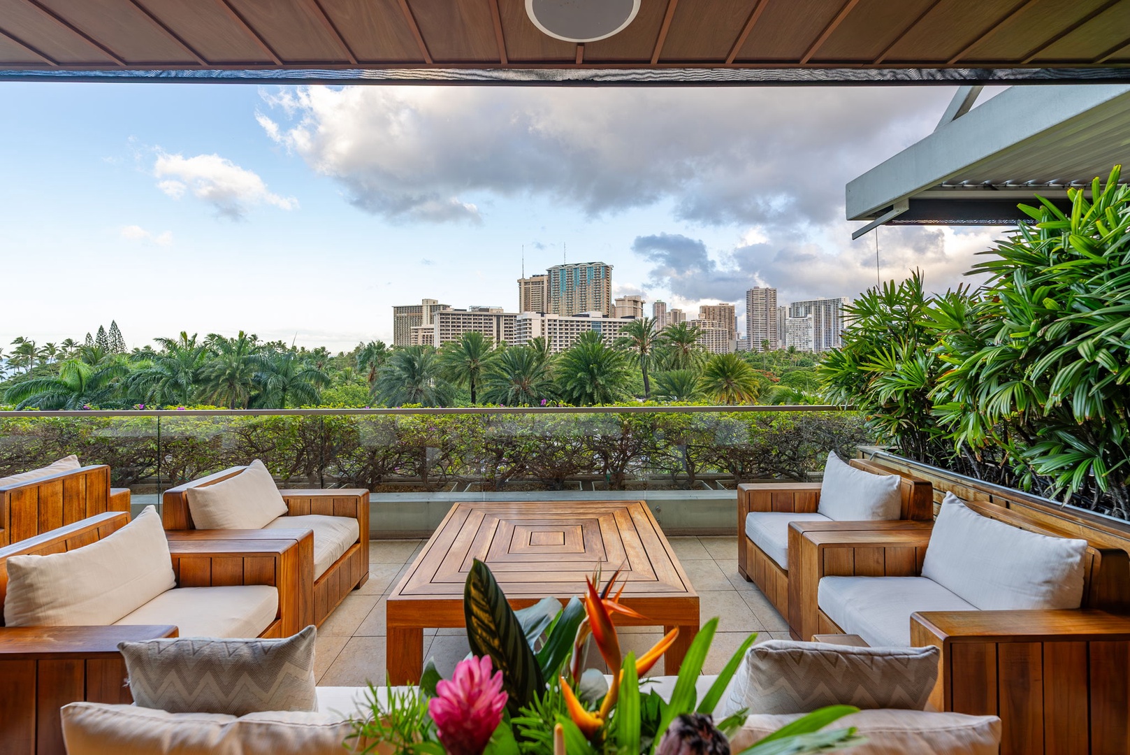 Honolulu Vacation Rentals, Kala'i 3203 - Comfortable outdoor seating area with a view of the city skyline, perfect for gatherings.