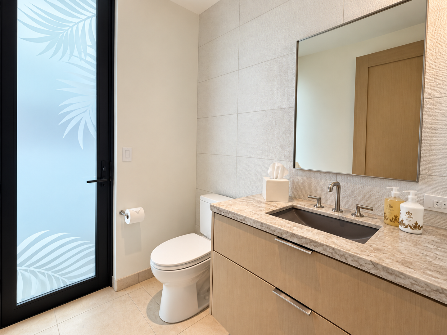 Kamuela Vacation Rentals, 6BD Mauna Lani Lux Golf Estate (5) at One Ocean - Just off the main living area, a modern powder room offers a sleek vanity and convenient side access through frosted-glass doors