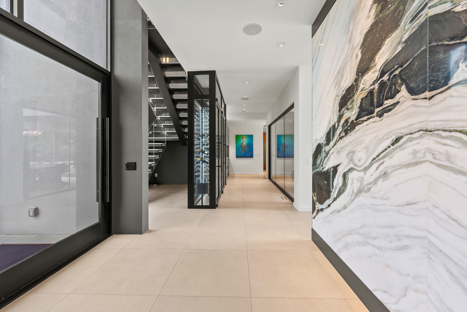 Honolulu Vacation Rentals, Ocean Villa Emilie - The entryway offers a warm welcome with high ceilings, organic textures, and sculptural lighting throughout.