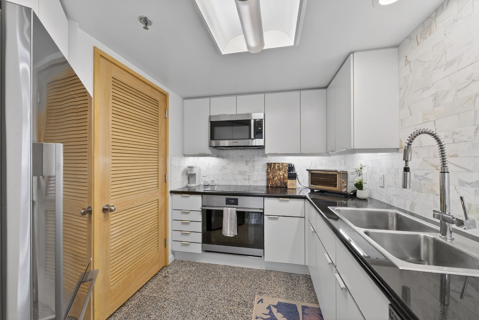 Honolulu Vacation Rentals, Island View at Waikiki Landmark - Prepare island meals in the refreshed kitchen with sleek appliances and stone counters.