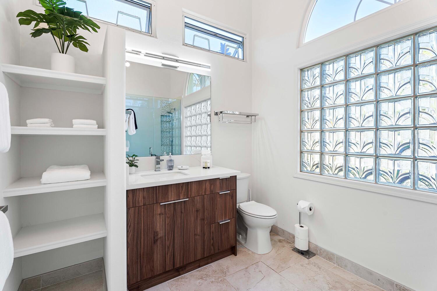 Kailua Kona Vacation Rentals, Ho'okipa Hale - Guest ensuite bathroom with ample vanity space and natural light—ideal for shared use.