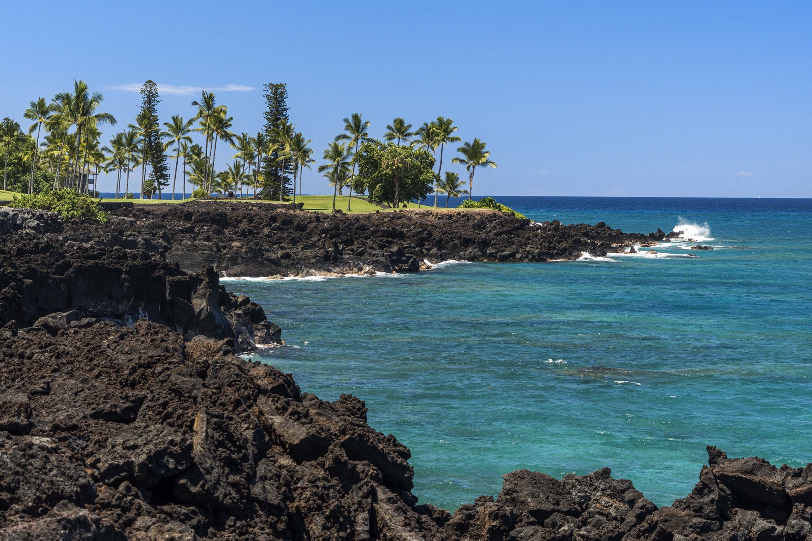 Kailua Kona Vacation Rentals, Keauhou Kona Surf & Racquet 1104 - Take in serene ocean views just steps from the property, perfect for a peaceful moment by the shore