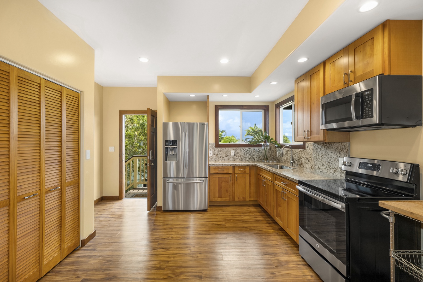 Haleiwa Vacation Rentals, Waimea Dream - The upstairs kitchen has modern finishes and a second entry door.
