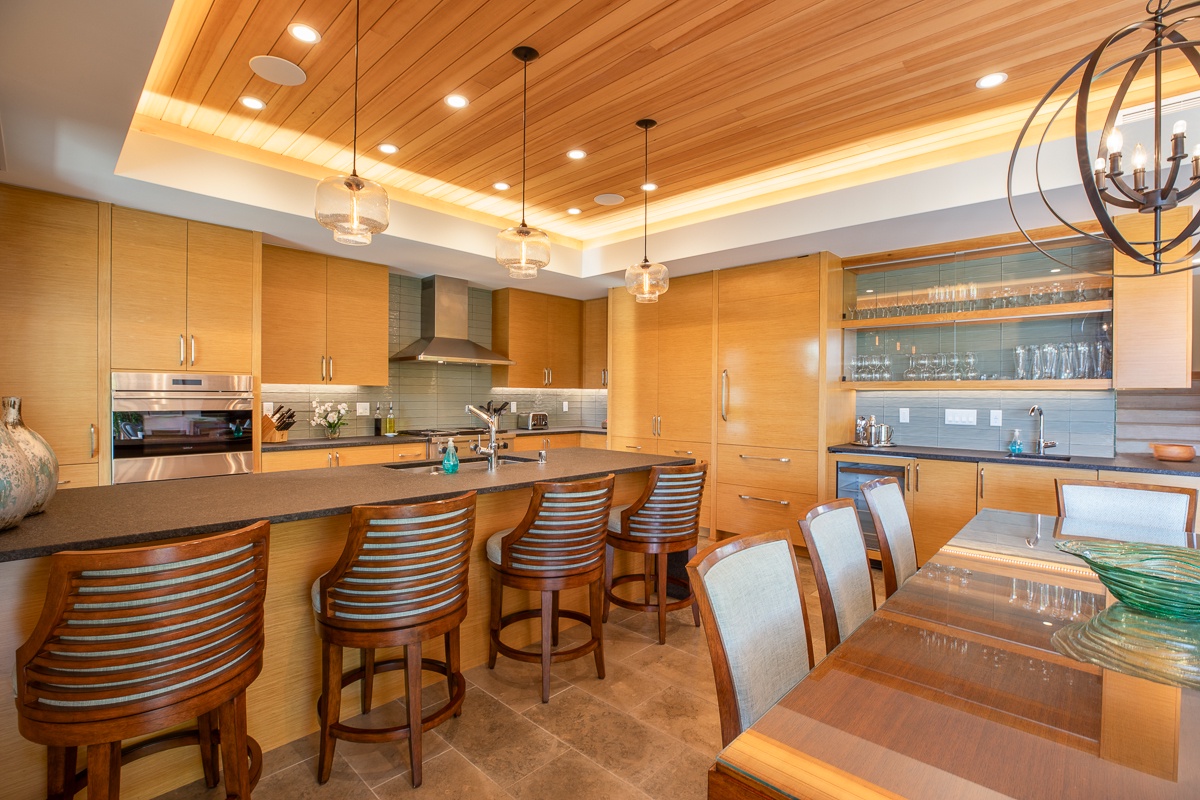 Kamuela Vacation Rentals, Laule'a at the Mauna Lani Resort #11 - Kitchen island/bar in the kitchen area, adjacent to the dining table.