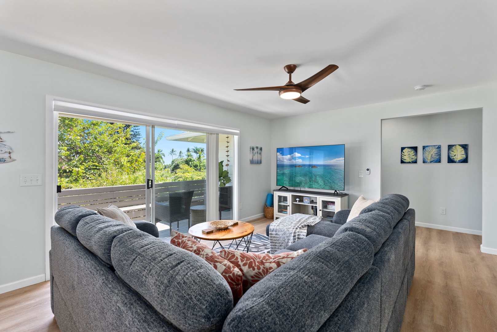 Kailua Vacation Rentals, Hale Alapi'i Lanikai Getaway - Cozy up in this inviting living area, complete with plush seating and a seamless flow to the scenic outdoor lanai.