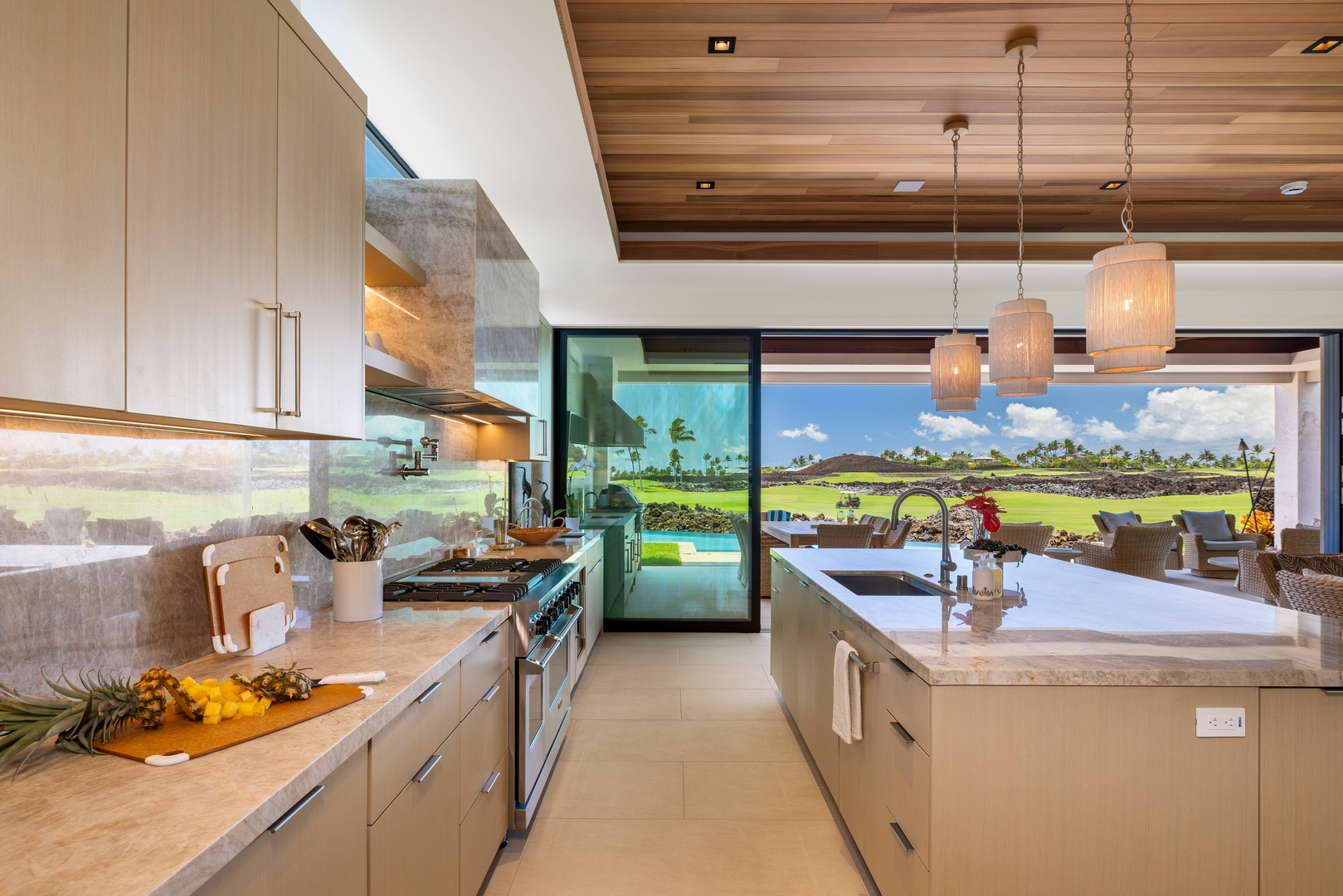 Kamuela Vacation Rentals, 6BD Mauna Lani Lux Golf Estate (5) at One Ocean - The well-appointed kitchen overlooks the lush fairways, bringing the beauty of the golf course into view.