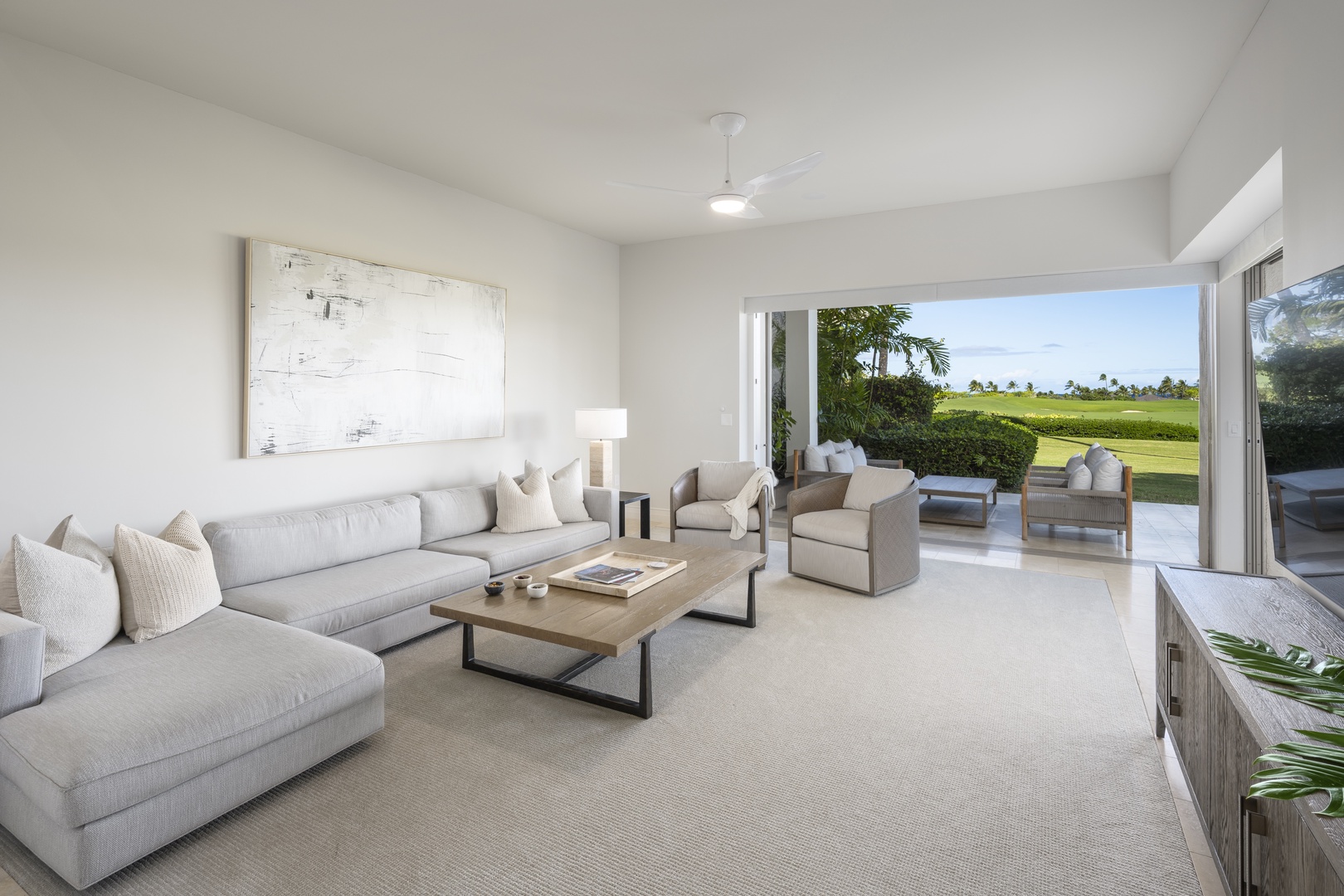 Kailua Kona Vacation Rentals, 3BD Palm Villa (130B) at Hualalai Resort - Sink into plush seating while enjoying stunning golf course views through floor-to-ceiling windows that blur the line between indoor comfort and outdoor beauty.