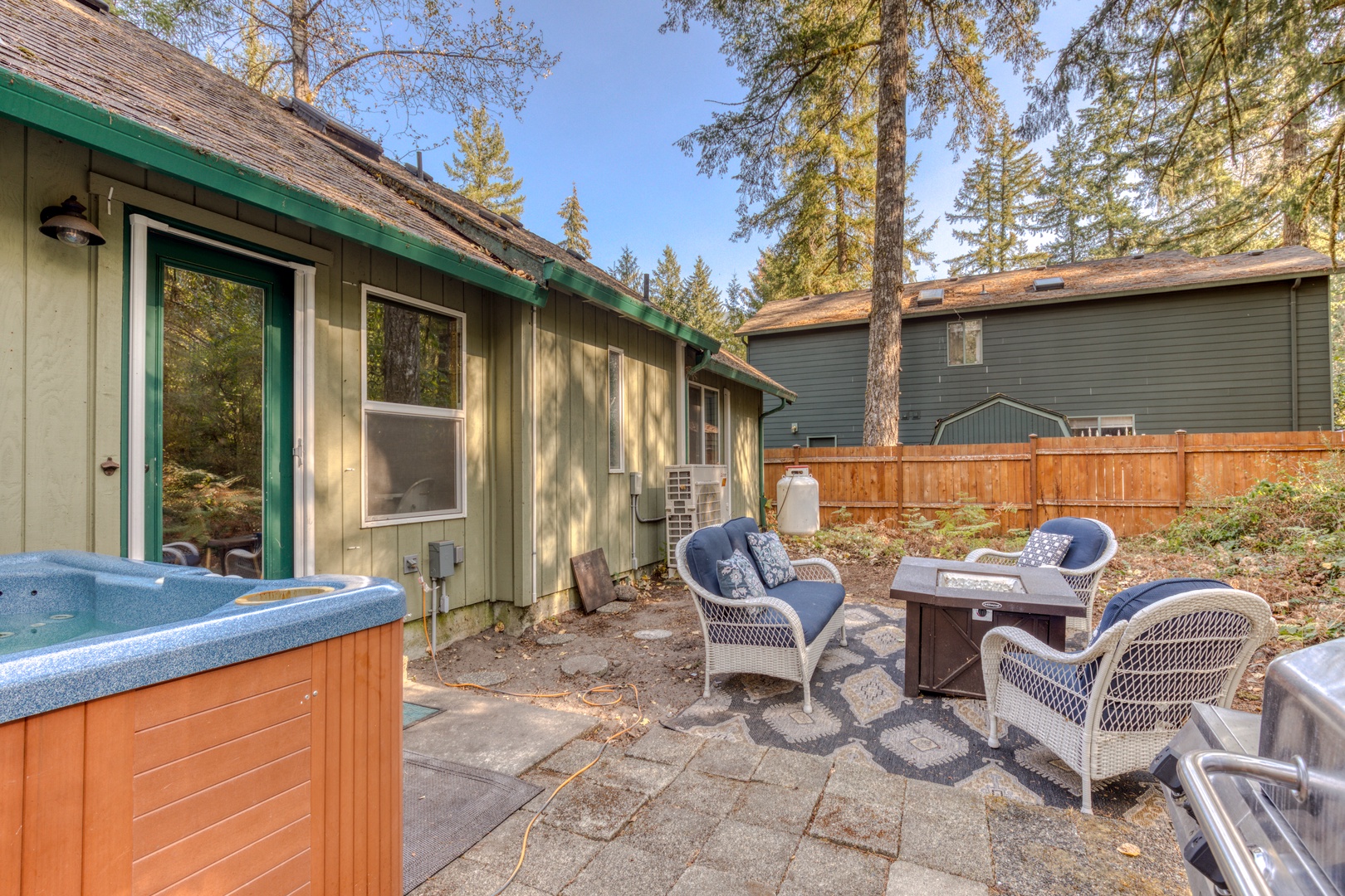 Brightwood Vacation Rentals, Riverside Retreat - Take a seat and warm up around the fire or soak in the hot tub