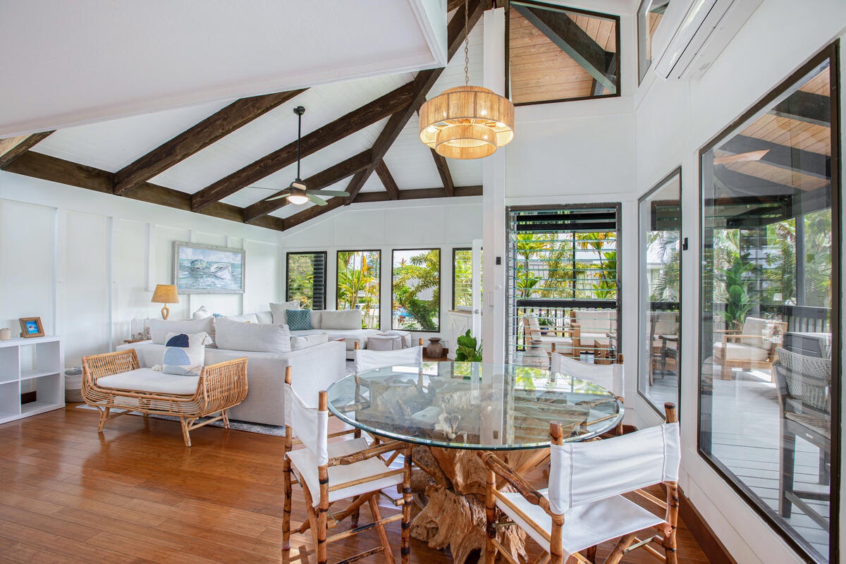 Princeville Vacation Rentals, Mauna Kai 11 - Enjoy shared meals beneath soaring ceilings in the open-concept dining room with garden views.