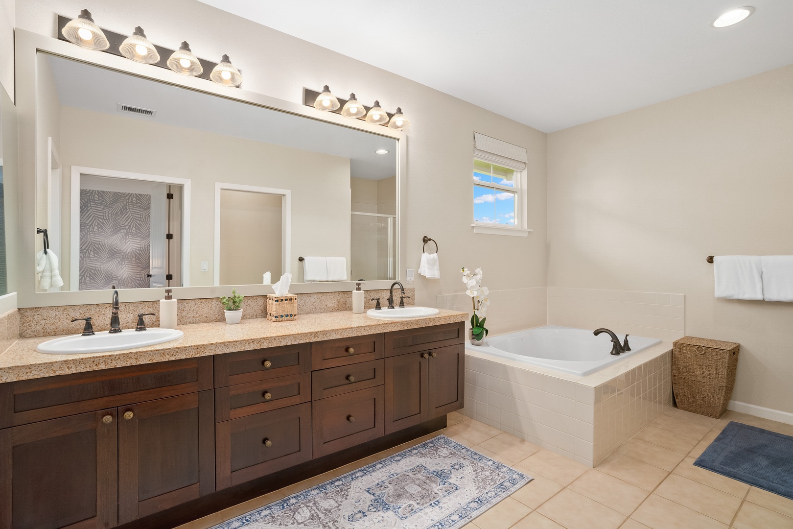 Princeville Vacation Rentals, Hale Kaua'i - Begin slow mornings in the spa-like bathroom with dual vanities and a soaking tub.
