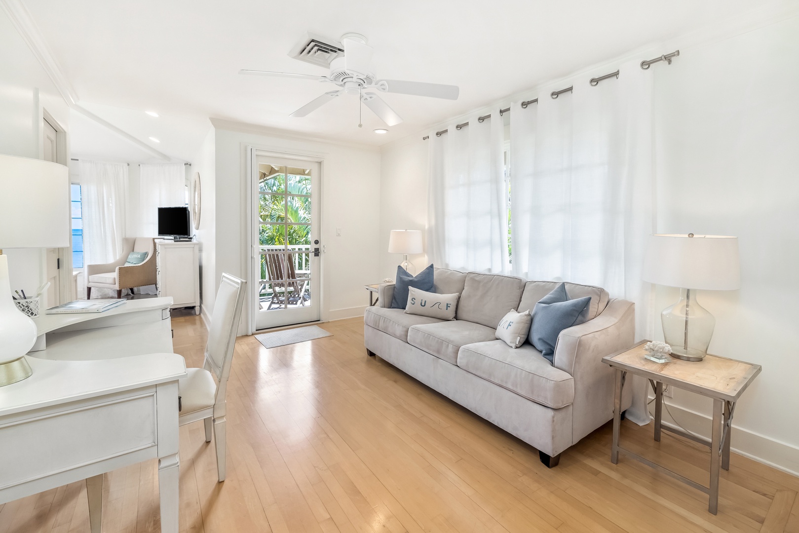 Honolulu Vacation Rentals, Moana Lani - Main House - Answer a few emails at the desk, or stretch out on the sofa in the sitting area.