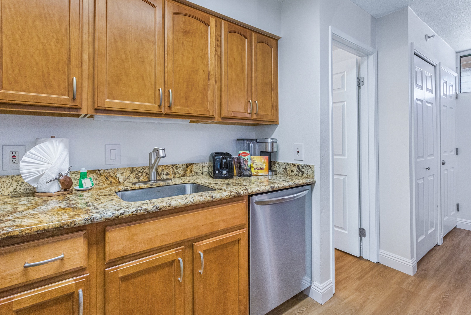 Lahaina Vacation Rentals, Royal Kahana 213 - Convenient kitchen space with granite countertops and modern appliances, perfect for quick meal prep or morning coffee.