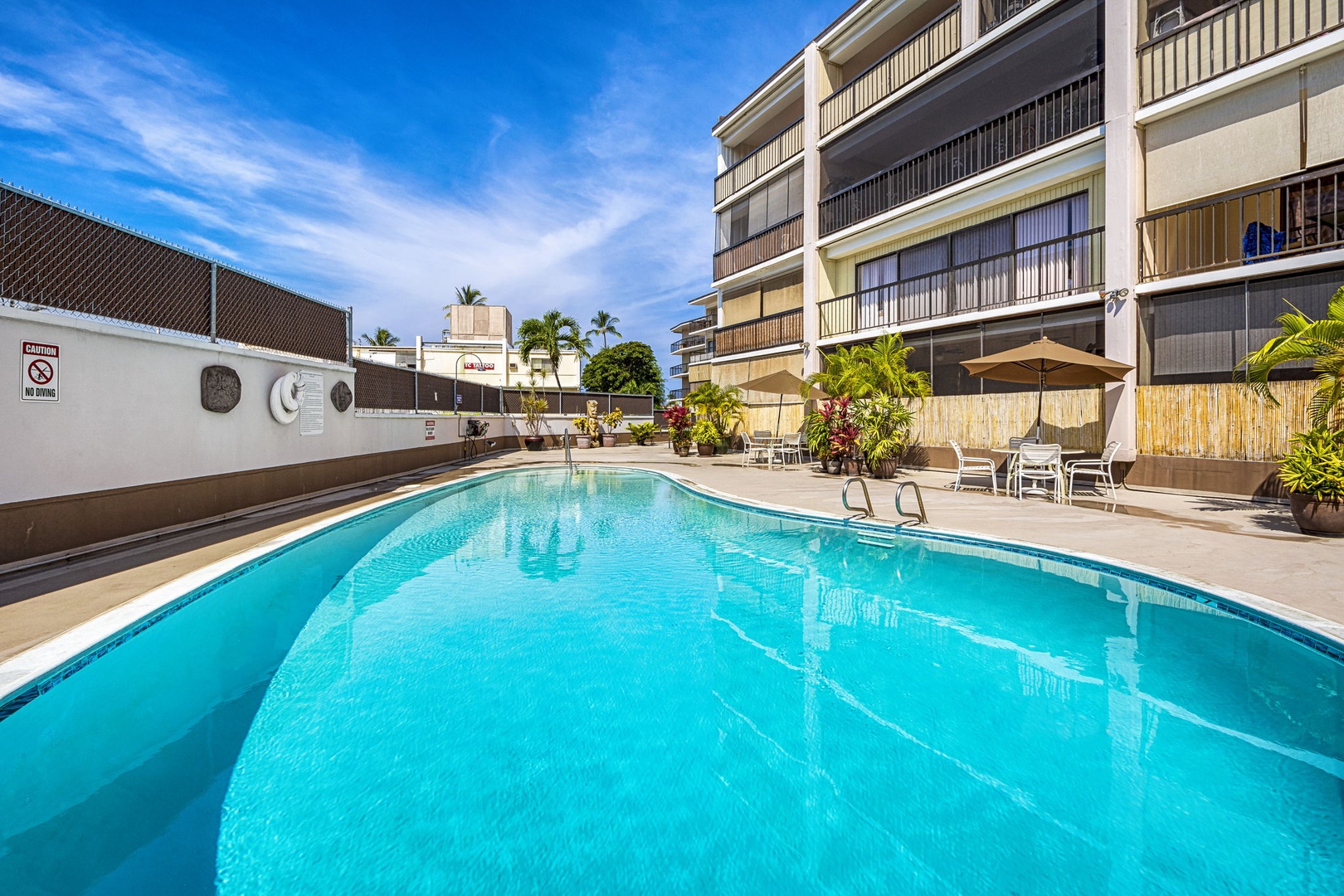 Kailua Kona Vacation Rentals, Kona Plaza 201 - Another view of the pristine pool offering a relaxing retreat within the complex.