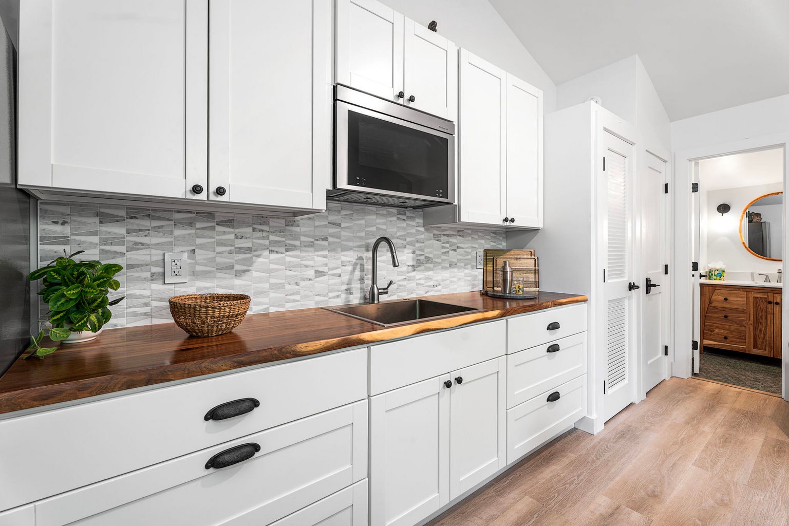 Kailua Kona Vacation Rentals, Manukai Hale - Butcher-block counters and white cabinets keep this kitchen bright and ready.
